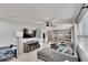 Bright living room with a flat screen television, built in bookshelves and comfortable furniture at 1607 Melodie Dr, Brandon, FL 33510