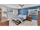 Comfortable main bedroom features a ceiling fan, natural light, and neutral carpeting at 1607 Melodie Dr, Brandon, FL 33510