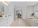 Bright bathroom features a tub, shower, marble counters, and a double sink vanity at 16206 Nottingham Park Way, Tampa, FL 33647