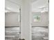 Spacious bedrooms featuring stylish floors, neutral walls, windows, and doors at 16206 Nottingham Park Way, Tampa, FL 33647
