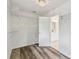 Walk-in closet with wood floors, white wire shelving, and a view into the bathroom at 16206 Nottingham Park Way, Tampa, FL 33647