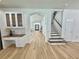 Entryway with arched opening and a view to the staircase at 16206 Nottingham Park Way, Tampa, FL 33647