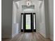 Entryway with decorative glass door and overhead window at 16206 Nottingham Park Way, Tampa, FL 33647