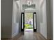 Entryway to home shows front yard at 16206 Nottingham Park Way, Tampa, FL 33647