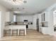 Spacious kitchen with white cabinets, pendant lighting, and stainless steel appliances at 16206 Nottingham Park Way, Tampa, FL 33647