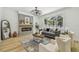 Bright living room features a modern fireplace, stylish decor, and ample natural light at 16206 Nottingham Park Way, Tampa, FL 33647