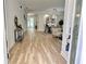 Open-concept living area showcasing hardwood floors, dining area, and direct access to the pool at 16206 Nottingham Park Way, Tampa, FL 33647
