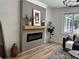 Living room with fireplace and gray sofa at 16206 Nottingham Park Way, Tampa, FL 33647
