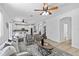Open-concept living area with hardwood floors, modern furniture, and great natural light at 16206 Nottingham Park Way, Tampa, FL 33647