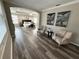 Spacious main bedroom with ensuite entrance, tray ceilings, area rugs, and wood flooring at 16206 Nottingham Park Way, Tampa, FL 33647