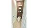 Modern powder room with floating shelves and sleek, integrated toilet at 16206 Nottingham Park Way, Tampa, FL 33647