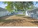 This spacious backyard has a privacy fence and a versatile outdoor area perfect for entertaining at 2002 Waikiki Way, Tampa, FL 33619