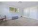 Well-lit bedroom has two windows and closet, offering a functional space with natural light at 2002 Waikiki Way, Tampa, FL 33619
