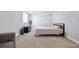 Spacious bedroom has a bed, light-colored walls, and soft carpeting, offering a blank canvas at 2002 Waikiki Way, Tampa, FL 33619