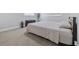 This bedroom features light-colored walls, a bed, and carpeted floors, creating a comfortable retreat at 2002 Waikiki Way, Tampa, FL 33619