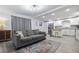 Inviting living room featuring a cozy couch and open view of the kitchen to create a welcoming atmosphere at 2002 Waikiki Way, Tampa, FL 33619