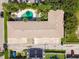 Aerial view of the community highlighting the central pool and surrounding landscaping at 208 Danube Ave # 101, Tampa, FL 33606