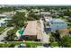 Aerial view of property with pool, mature trees, and covered parking at 208 Danube Ave # 101, Tampa, FL 33606