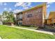 Charming two-story brick exterior with landscaped yard and convenient covered parking at 208 Danube Ave # 101, Tampa, FL 33606