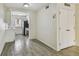 Bright kitchen featuring modern appliances, white cabinets, and gray wood-look tile floors at 208 Danube Ave # 101, Tampa, FL 33606