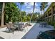 Outdoor patio area with comfortable seating and lush tropical surroundings near pool at 208 Danube Ave # 101, Tampa, FL 33606