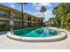 Inviting pool area with lush tropical landscaping and comfortable lounge chairs at 208 Danube Ave # 101, Tampa, FL 33606