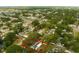 Aerial view of a house with large lot in a leafy neighborhood, outlined in red at 2222 Euclid N Cir, Clearwater, FL 33764