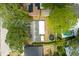Aerial view of a property featuring lush landscaping, a pool, and a trampoline at 2222 Euclid N Cir, Clearwater, FL 33764