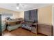 Comfortable bedroom with a ceiling fan, featuring a bunk bed, a crib, and a dresser at 2222 Euclid N Cir, Clearwater, FL 33764