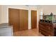 Bedroom with closet and dresser for storage, featuring vinyl wood-look floors at 2222 Euclid N Cir, Clearwater, FL 33764