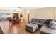 Inviting living room with wood floors, comfortable seating, and an adjacent dining area at 2222 Euclid N Cir, Clearwater, FL 33764