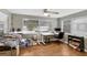 Bright home office featuring wood floors, two large windows, and white desks for a productive workspace at 2222 Euclid N Cir, Clearwater, FL 33764