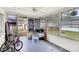 Enclosed porch with screened windows, ideal for enjoying the outdoors while staying protected from insects at 2222 Euclid N Cir, Clearwater, FL 33764