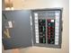 Electrical panel box with circuit breakers and labeled switches, providing a sense of safety at 2463 Brazilia Dr # 43, Clearwater, FL 33763