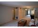 Spacious living room with carpeting, a decorative wall, and a mirrored wall at 2463 Brazilia Dr # 43, Clearwater, FL 33763