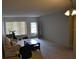 A cozy living room with a sofa, coffee table, and an exit door to the outside at 2463 Brazilia Dr # 43, Clearwater, FL 33763