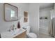 Updated bathroom features modern vanity, fixtures and a bathtub/shower with decorative tile niche at 2575 Granada E Cir, St Petersburg, FL 33712