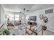 Bright living room featuring neutral tones, modern decor, and ample natural light at 2575 Granada E Cir, St Petersburg, FL 33712