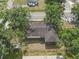 Aerial view of a home with mature landscaping and a large backyard at 2724 W Henry Ave, Tampa, FL 33614