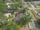 Aerial view of a home with mature landscaping and a large backyard at 2724 W Henry Ave, Tampa, FL 33614