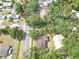 Aerial view of a home with mature landscaping along a city street at 2724 W Henry Ave, Tampa, FL 33614