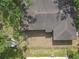 Aerial view of a home with a fenced yard and mature trees at 2724 W Henry Ave, Tampa, FL 33614