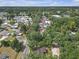 Aerial view of a home with mature landscaping in a residential neighborhood at 2724 W Henry Ave, Tampa, FL 33614