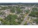 Aerial view of a home with mature landscaping, near the city at 2724 W Henry Ave, Tampa, FL 33614