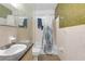 Bathroom with single vanity, mirror, toilet and shower/tub combo, ready for customization at 2724 W Henry Ave, Tampa, FL 33614