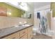 Bathroom with single vanity, mirror, toilet and shower/tub combo, ready for customization at 2724 W Henry Ave, Tampa, FL 33614