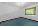 Bedroom with chandelier, minimal window and blue carpeting, ready for customization at 2724 W Henry Ave, Tampa, FL 33614