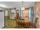 Dining area with table and chairs adjacent to the kitchen at 2724 W Henry Ave, Tampa, FL 33614