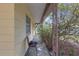 Covered porch area offering a shady spot to relax at 2724 W Henry Ave, Tampa, FL 33614
