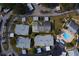 Aerial view showcasing the villa, surrounding landscaping, carports, and community pool nearby at 2749 Countryside Blvd # 4, Clearwater, FL 33761
